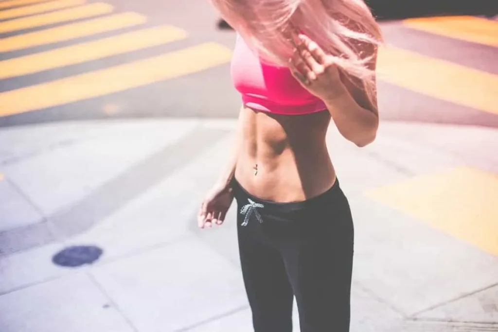 Woman with toned stomach after LA-EMS Body Sculpting Treatment Dover